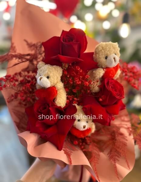 Tre rose rosse con orsetti